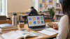 Graduate student workspace with laptop books notebook and free resource icons for student freebies in 2026