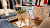 H&M hacks guide with folded clothes shopping app receipt and reusable bag for saving money on fashion orders